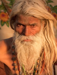 Colour photographic portrait of a bearded yogi by Michael O'Neill