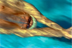 colour photograph of the swimmer, Lenny Krayzelberg, underwater and moving at speed